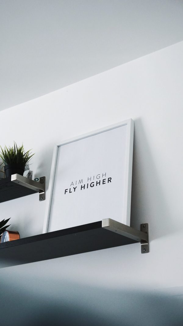 "Aim high, fly higher" quote