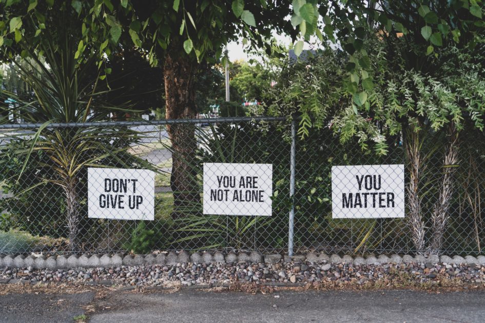 photo of signs that say "Don't give up" "you are not alone" "you matter"